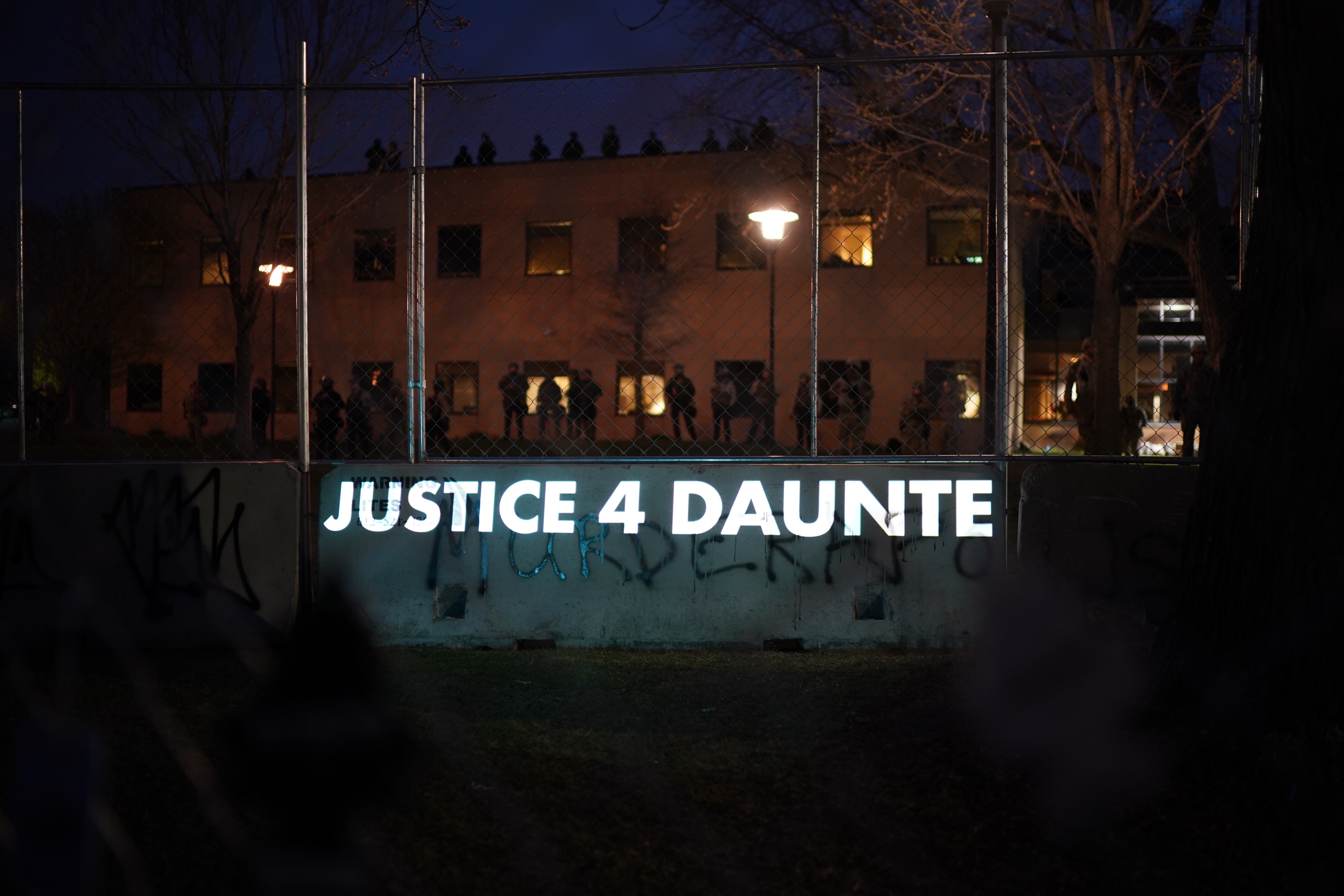 Messages were projected onto the barrier separating  demonstrators from police. 

    



Demonstrators gathered for a protest near the Brooklyn Center Police Department on Thursday, April 15, 2021 in response to the fatal police shooting of Daunte Wright in Brooklyn Center, Minn. Former Brooklyn Center police officer Kimberly Potter was charged with second degree manslaughter after the shooting, which occurred on Sunday, April 11.    ]  JEFF WHEELER • jeff.wheeler@startribune.com